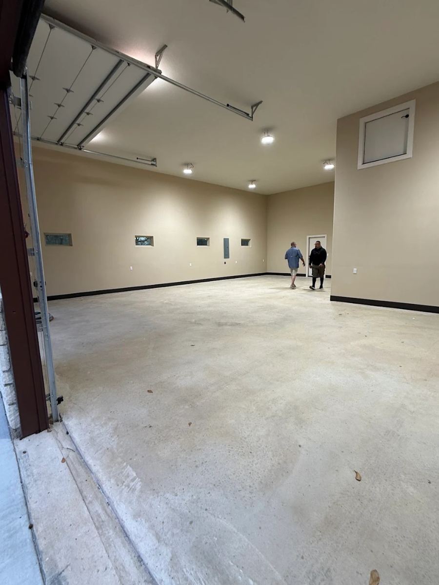 1 — Before: bare slab, oversized shop garage